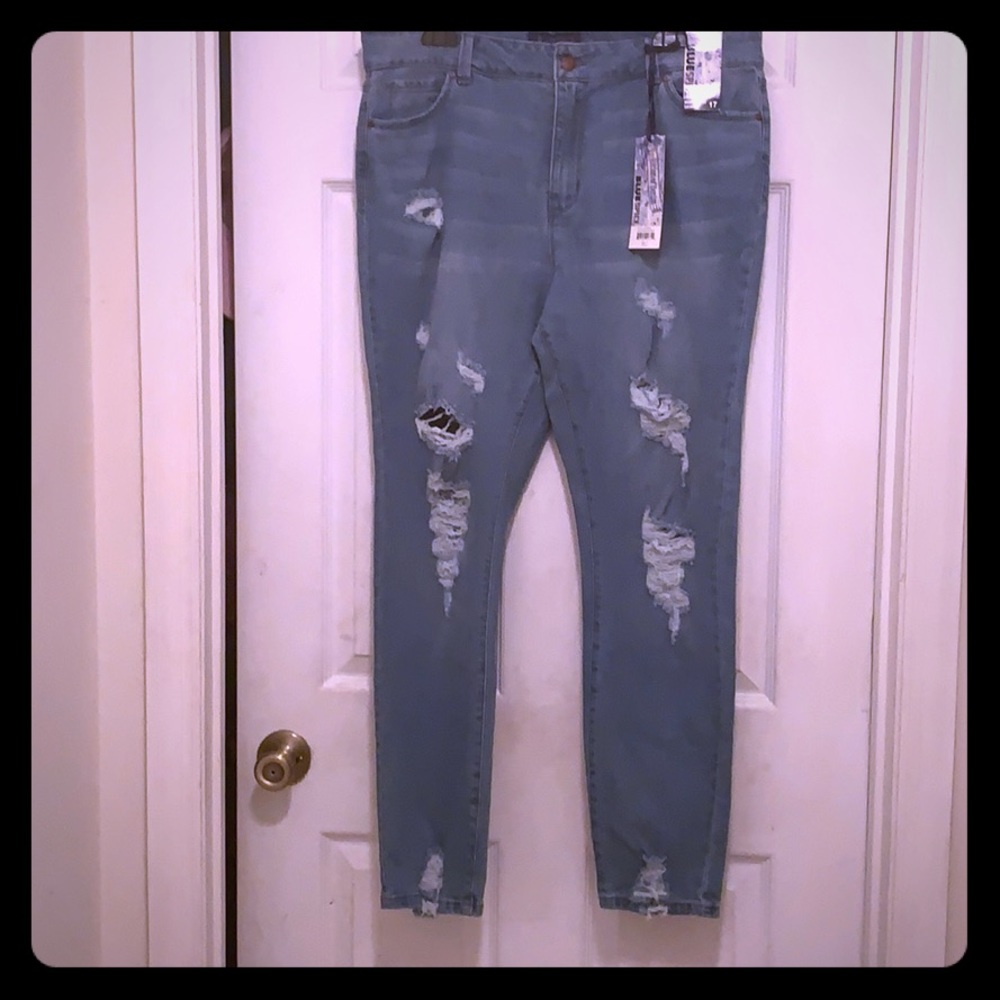 Ripped blue spice blue jeans